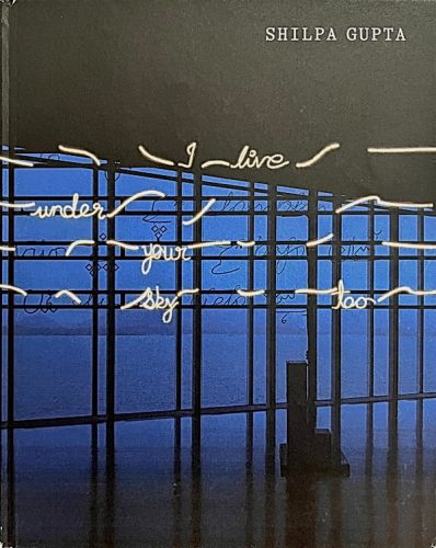 Shilpa Gupta art book cover with neon text 'I live under your sky too' in a blue windowed gallery installation.